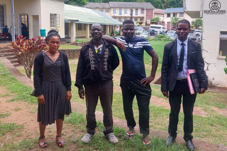 Counsel Ching'anda with the accused (in a sweater) and relatives