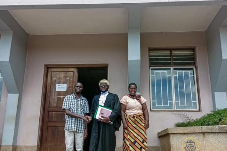 Shaba (left) poses with counsel and his sister